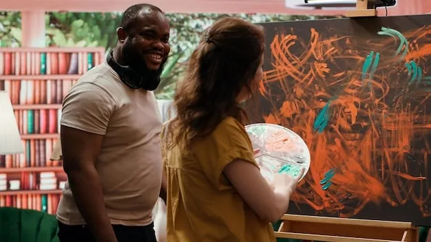 A diverse group of US graffiti artists collaborating on a large-scale mural, sharing spray cans and laughing, with a sense of camaraderie and shared purpose evident.