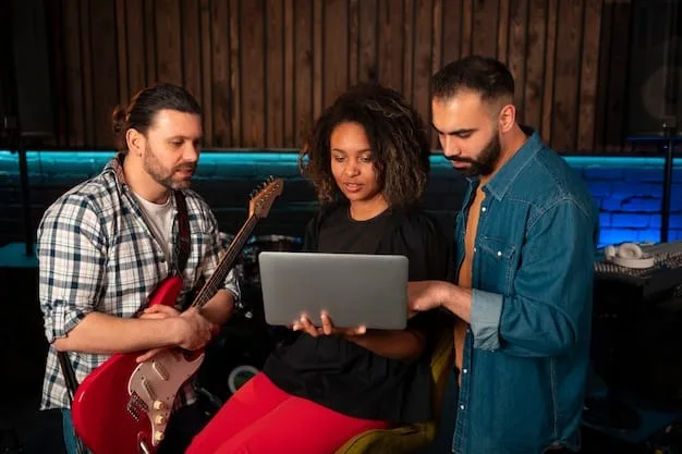 A diverse group of young music producers collaborating in a modern studio environment, with one person gesturing towards a screen displaying a visual representation of AI processing music, emphasizing teamwork and innovation.