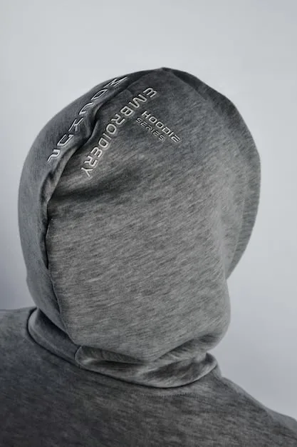 Close-up of a sustainable streetwear hoodie, showcasing the detailed texture of recycled cotton fabric and a minimalist eco-friendly tag.