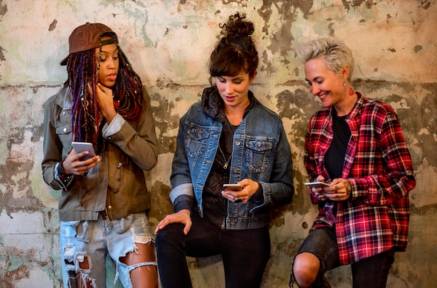 A diverse group of young women, inspired by hip hop, participating in a rap workshop, practicing freestyling and writing lyrics, symbolizing the future generation of female artists.