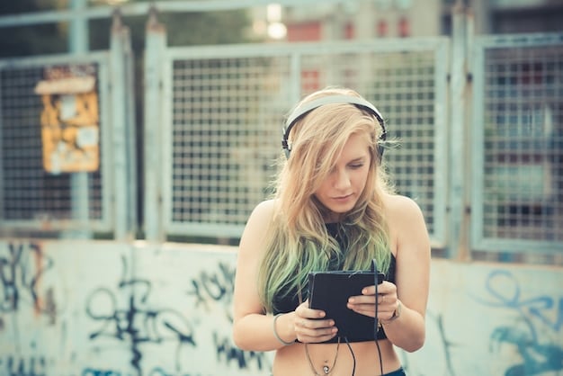 A person wearing headphones, looking at a smartphone displaying the Spotify app with a hip hop playlist open, sitting in a contemporary, urban setting, symbolizing modern music consumption.