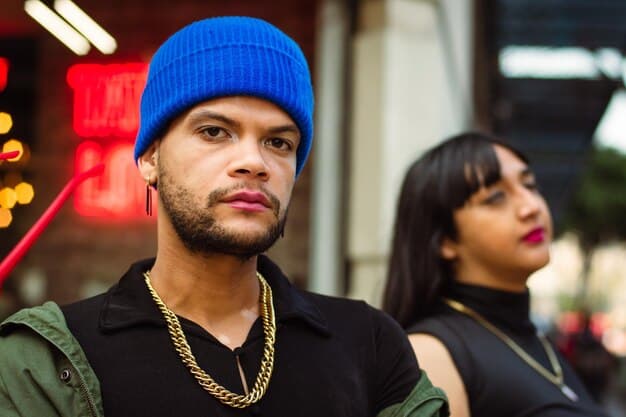 A close-up shot of two young rap artists engaging in a focused conversation with a music industry executive at a conference. The atmosphere is professional and engaging, highlighting the importance of making a good first impression.