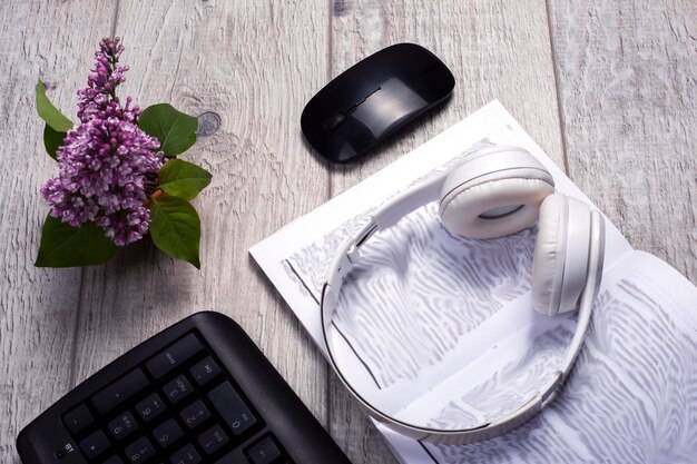 A detailed contract lying on a table next to a pair of headphones and a microphone. The contract is partially highlighted, with sections concerning revenue sharing and rights ownership clearly visible. The image emphasizes the importance of carefully reviewing legal agreements.