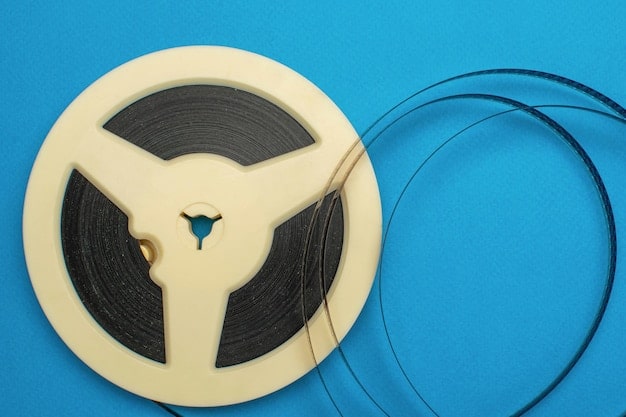 A film reel with musical notes overlapping, representing the synchronization of music and visual media, highlighting the importance of obtaining sync licenses for independent labels in the US.