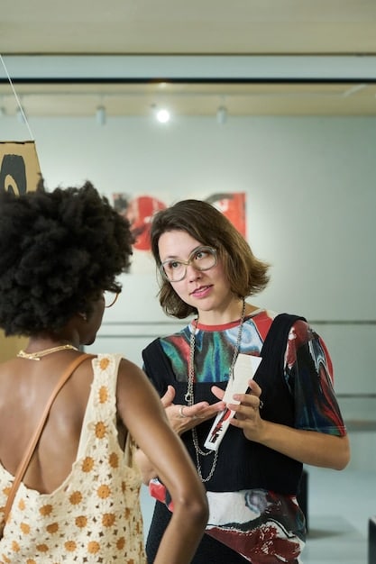 An artist interacting with fans after a concert, signing autographs and taking photos, showcasing the personal connection between artists and their audience.