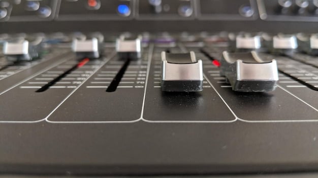 A close-up of various audio plugins used in mastering, such as a limiter, equalizer, and compressor, displayed on a computer screen within a digital audio workstation (DAW).