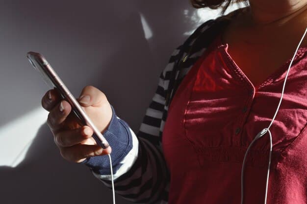 A mobile phone showing a music streaming app with several rap playlists. The phone is displaying a message from an artist to a playlist curator, pitching their latest track. The background is blurred, focusing attention on the phone screen.