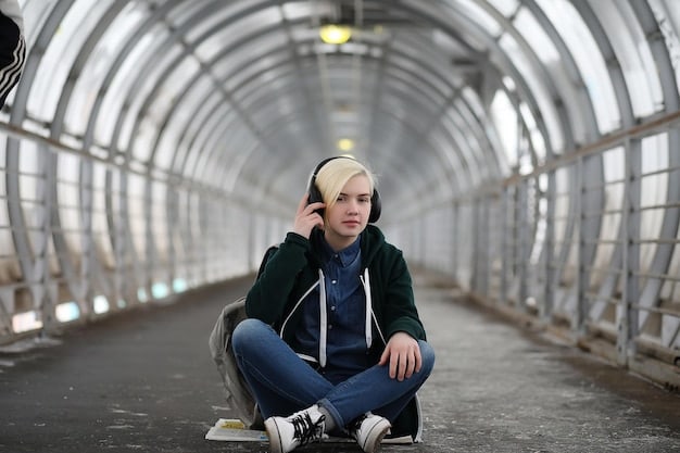 An underground rapper sitting alone on a studio couch, looking overwhelmed, with headphones around their neck, with a blurry recording equipment in the background and graffiti art in the walls.