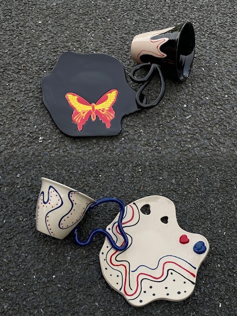 A detailed flat lay of streetwear accessories – a branded cap, a custom patch, a stylish watch, and a pair of sneakers – arranged aesthetically on a textured urban background.