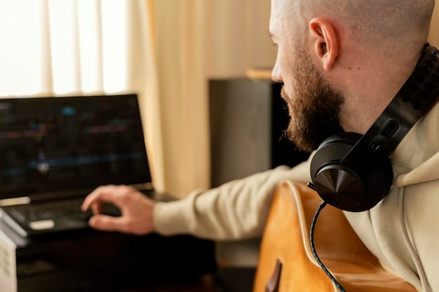 A music producer in a home studio, headphones on, intently mixing tracks on a digital audio workstation, surrounded by soundproofing panels, symbolizing independent music creation.