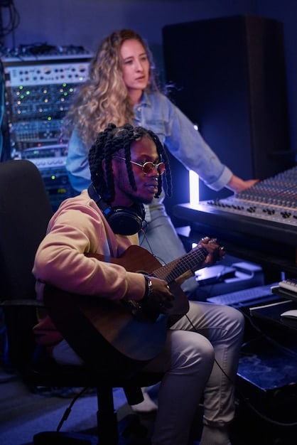 Diverse musicians and sound engineers collaborating in a vibrant, dimly lit recording studio, surrounded by synthesizers, mixing boards, and microphones, capturing the essence of creative synergy and technical expertise.