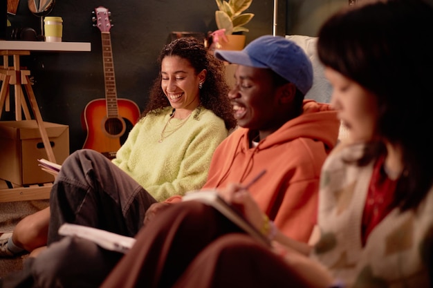 A diverse group of young, independent musicians collaborating in a communal studio space, with AI interfaces integrated into simple laptops acting as their DAWs, highlighting accessibility and collaboration.